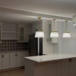 Basement kitchenette with island and pendant lights by Miguel's General Construction