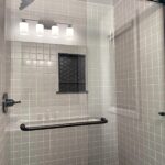 Basement bathroom glass-door shower