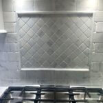 Marble kitchen backsplash with diamond inlay